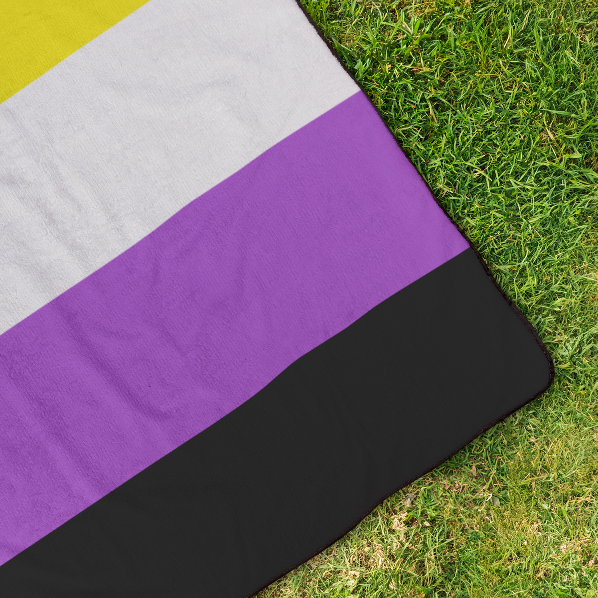Nonbinary_Pride_Stadium_Blanket_StadiumBlanket_OverheadGrass_H_Mockup.png