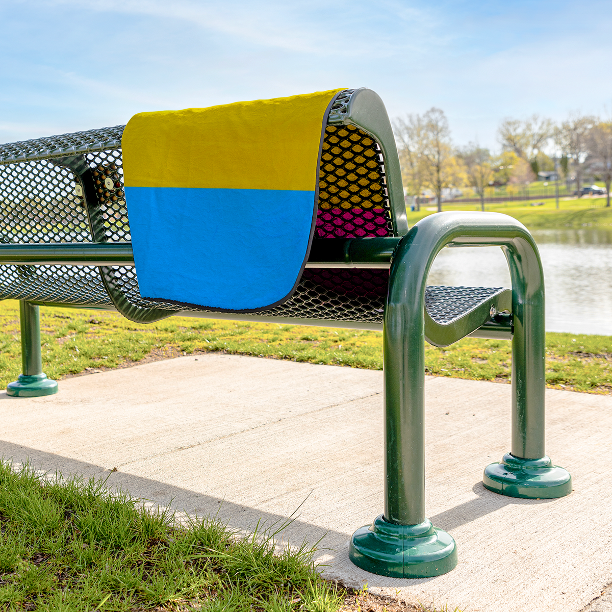 Pan_Pride_Stadium_Blanket_StadiumBlanket_Lifestyle_Bench_H_AS_Mockup.png